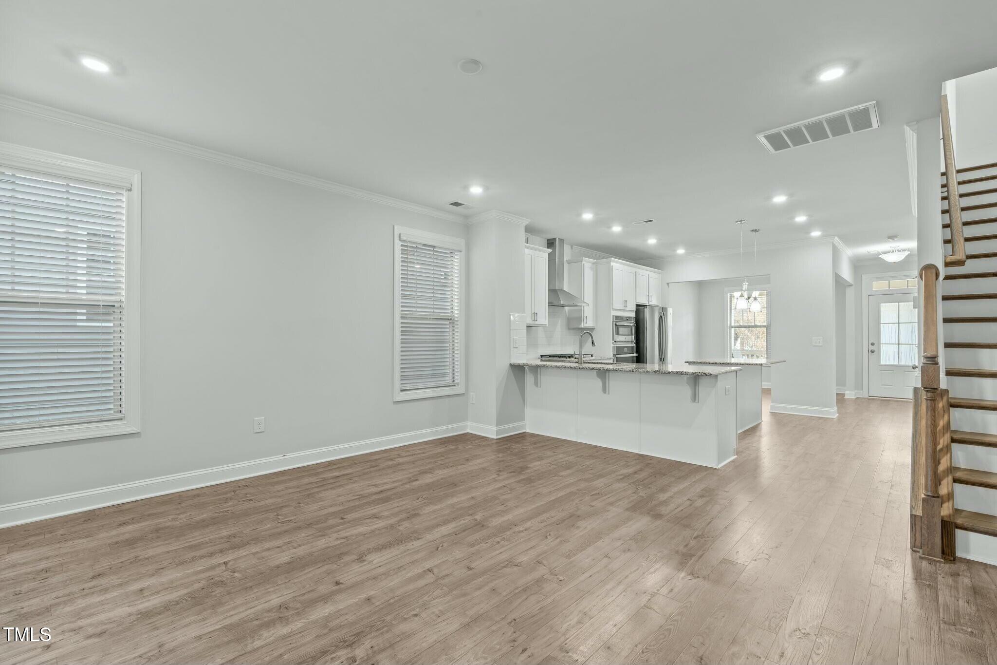 6417 Truxton Lane Raleigh, NC 27616 - Photo 15 of 47 a view of kitchen with kitchen island and stainless steel appliances