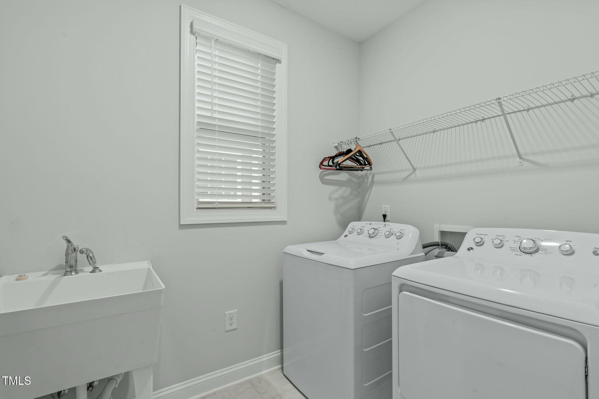 6417 Truxton Lane Raleigh, NC 27616 - Photo 20 of 47 a utility room with dryer and washer