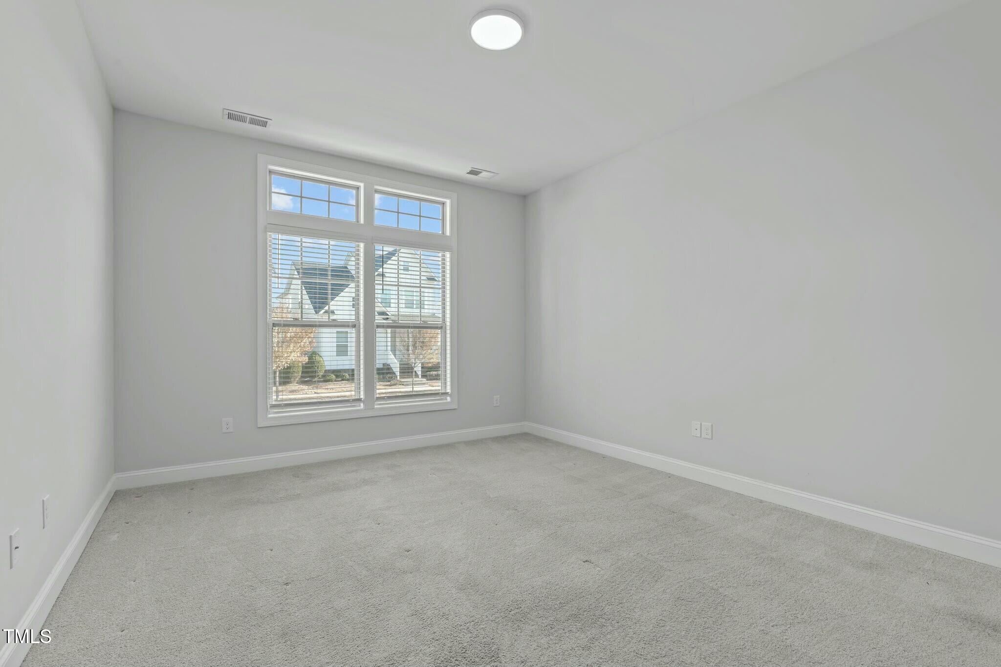 6417 Truxton Lane Raleigh, NC 27616 - Photo 21 of 47 an empty room with a window