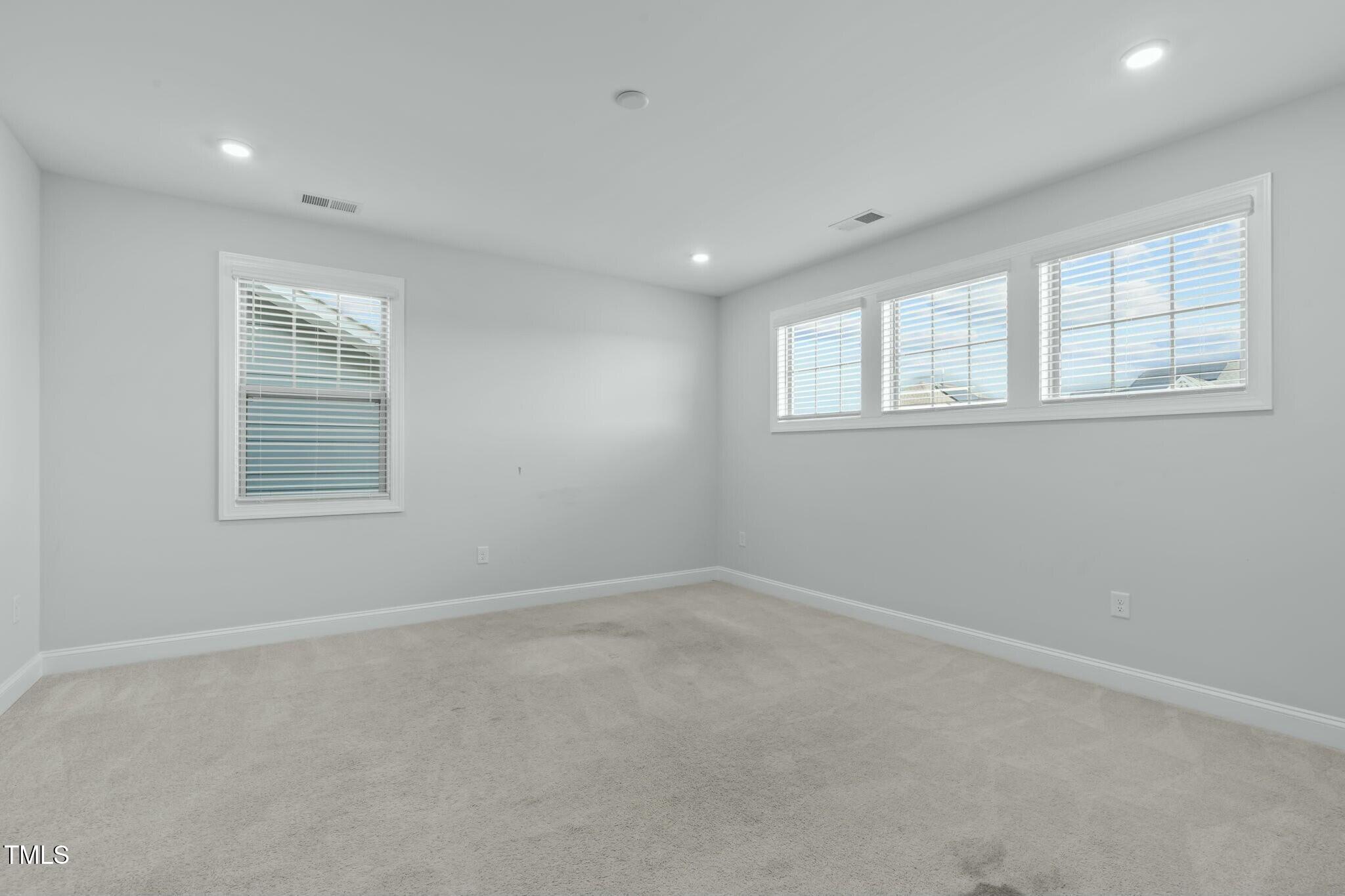 6417 Truxton Lane Raleigh, NC 27616 - Photo 28 of 47 an empty room with windows
