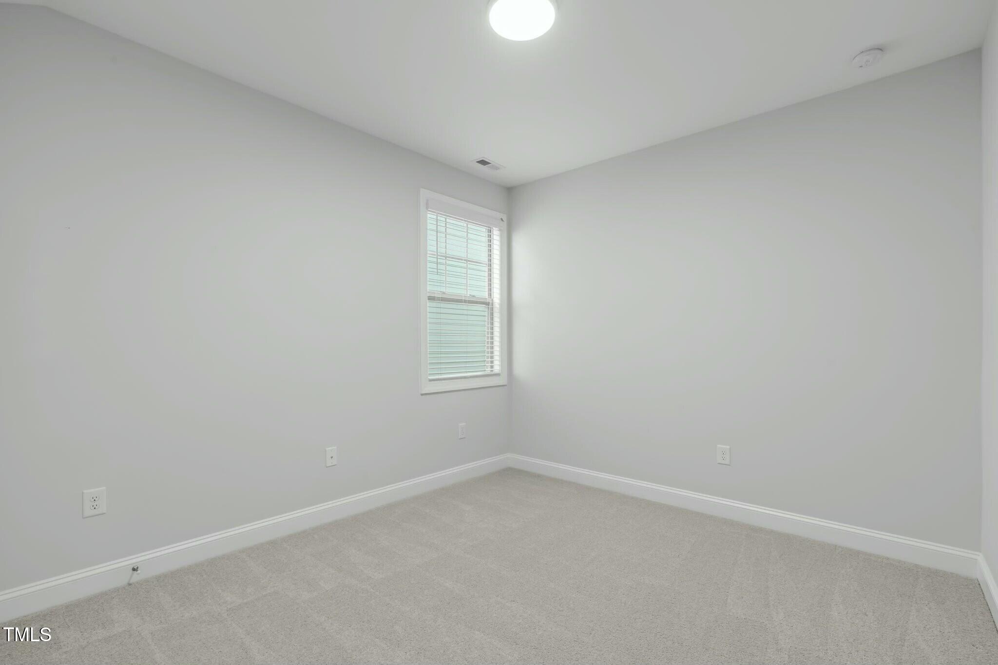 6417 Truxton Lane Raleigh, NC 27616 - Photo 32 of 47 an empty room with a window