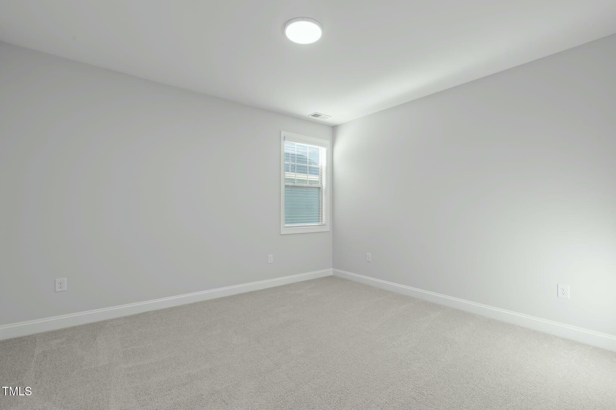 6417 Truxton Lane Raleigh, NC 27616 - Photo 37 of 47 an empty room with a window