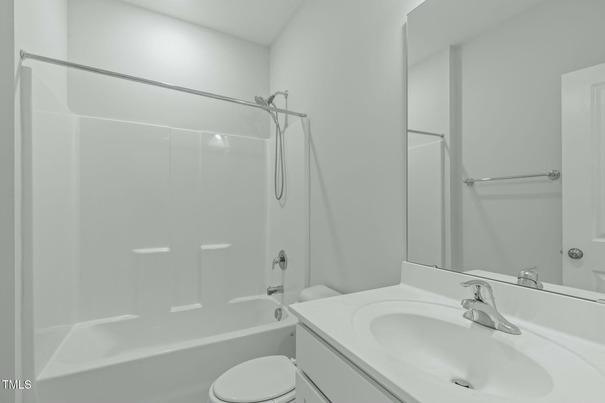 6417 Truxton Lane Raleigh, NC 27616 - Photo 39 of 47 a bathroom with a sink toilet and shower