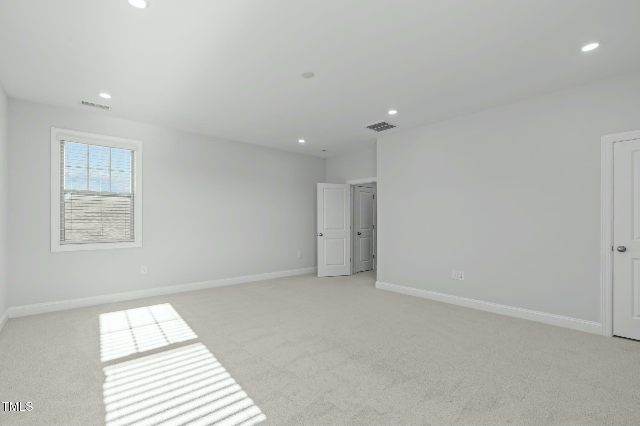 6417 Truxton Lane Raleigh, NC 27616 - Photo 41 of 47 an empty room with a window