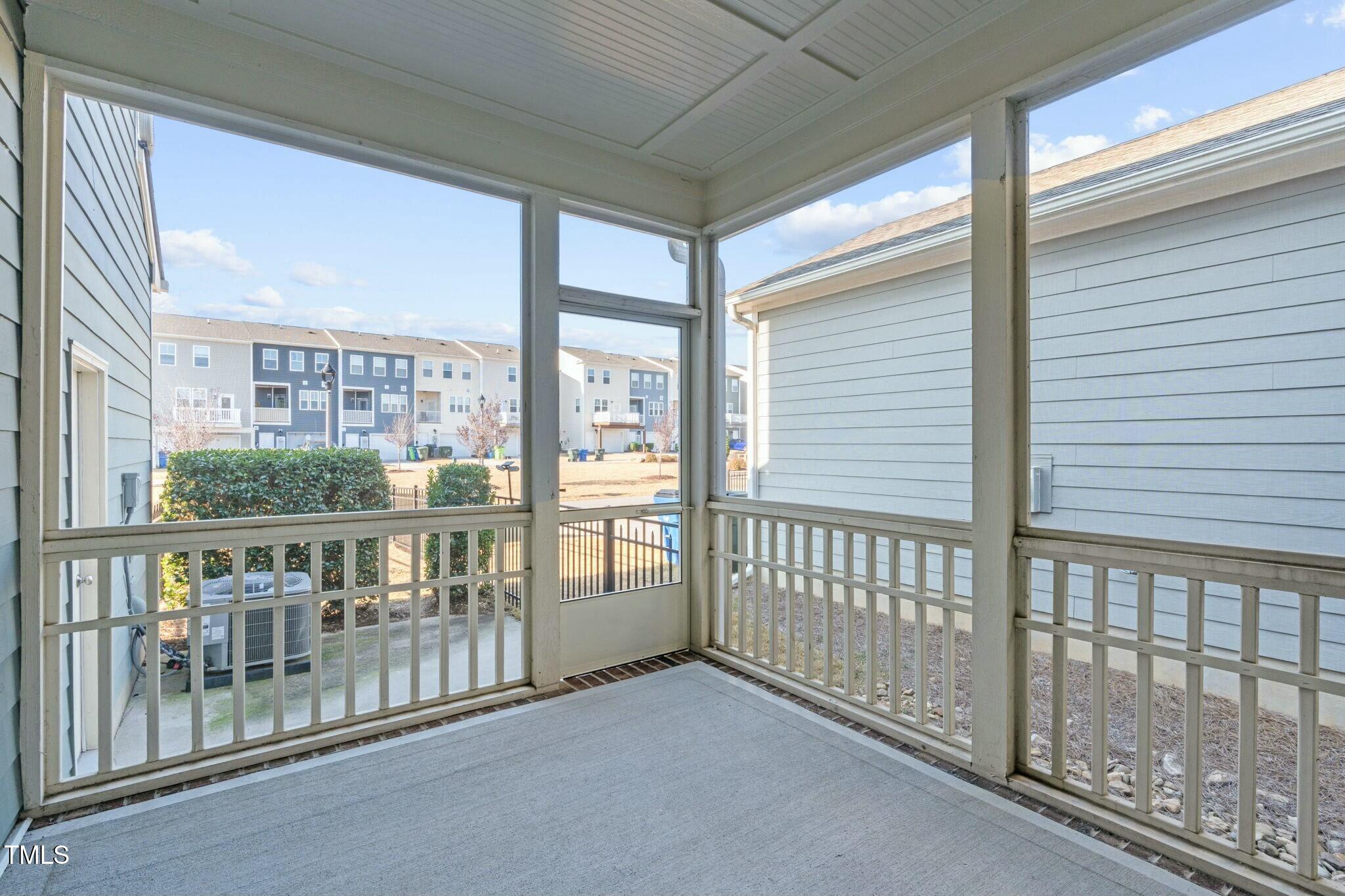 6417 Truxton Lane Raleigh, NC 27616 - Photo 42 of 47 a view of a porch with a floor to ceiling window