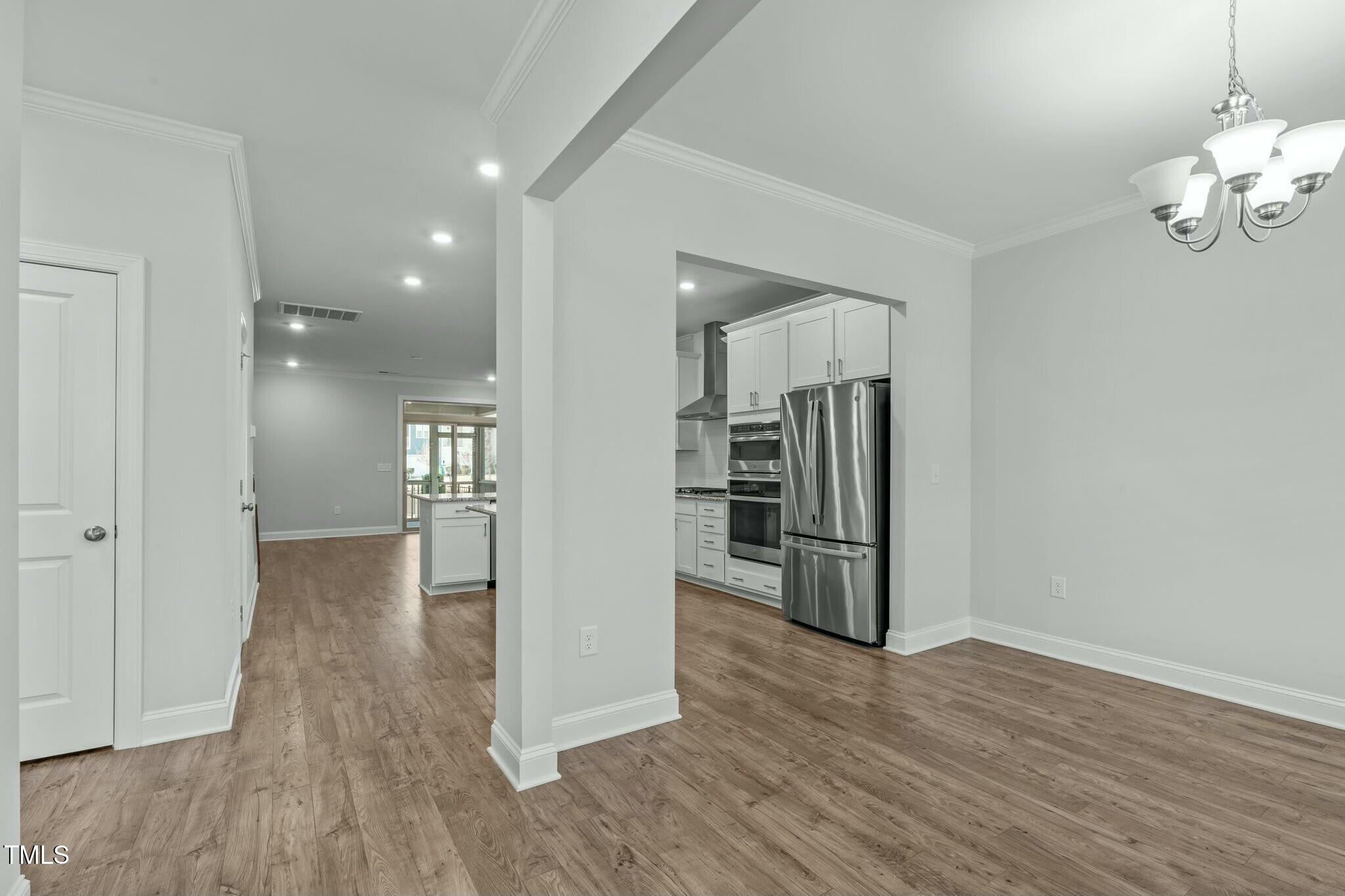 6417 Truxton Lane Raleigh, NC 27616 - Photo 5 of 47 a view of kitchen with furniture and wooden floor
