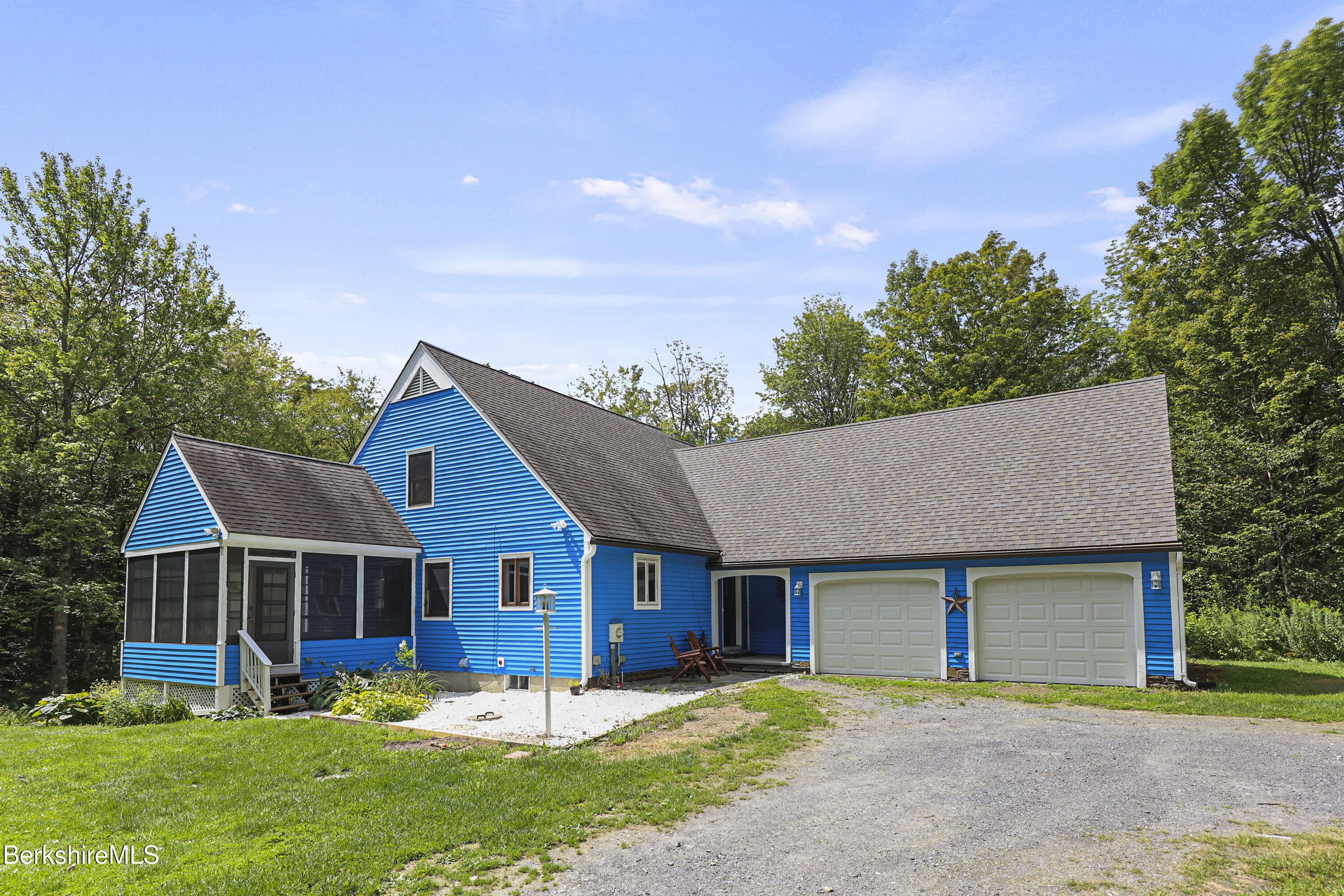 915 High St Hill Road Windsor, MA 01270 - Photo 1 of 54 a front view of a house with a yard and trees