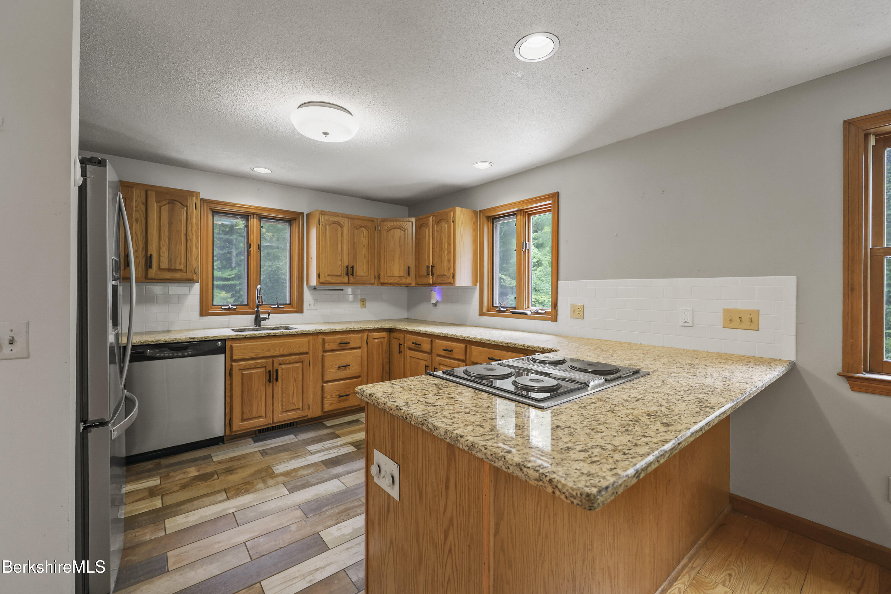 915 High St Hill Road Windsor, MA 01270 - Photo 13 of 54 a kitchen with granite countertop sink stove and refrigerator