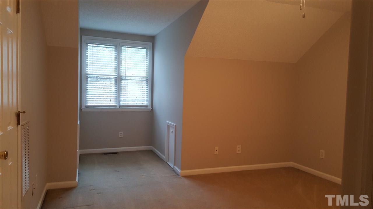 6036 Epping Forest Drive Raleigh, NC 27613 - Photo 15 of 21 Another view of 3rd floor bonus room facing dormer. The sides of the dormers house additional storage spaces. 2 small doors on each side of the dormer walls.