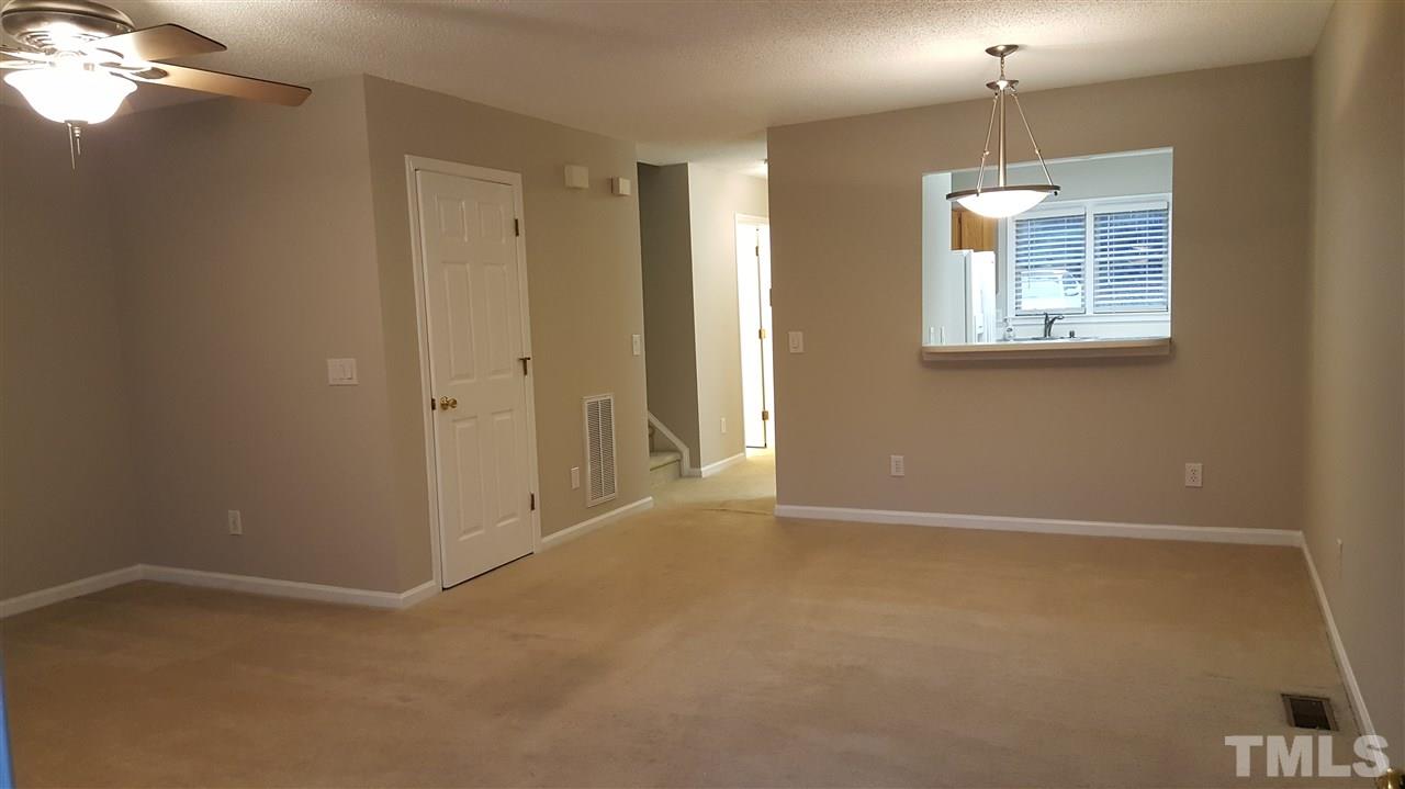 6036 Epping Forest Drive Raleigh, NC 27613 - Photo 4 of 21 View from the back door into the dining area and Kitchen pass through. Updated light fixture