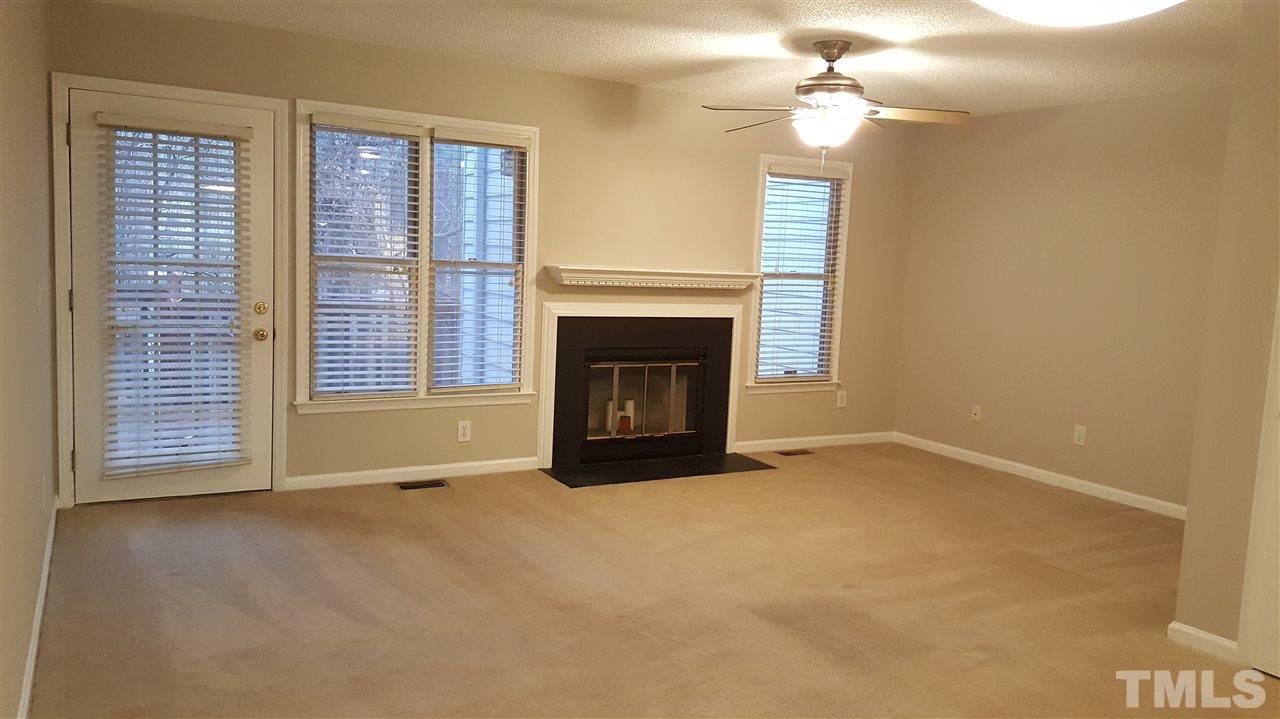 6036 Epping Forest Drive Raleigh, NC 27613 - Photo 8 of 21 New Ceiling fan, wood burning fireplace, storm door at back door
