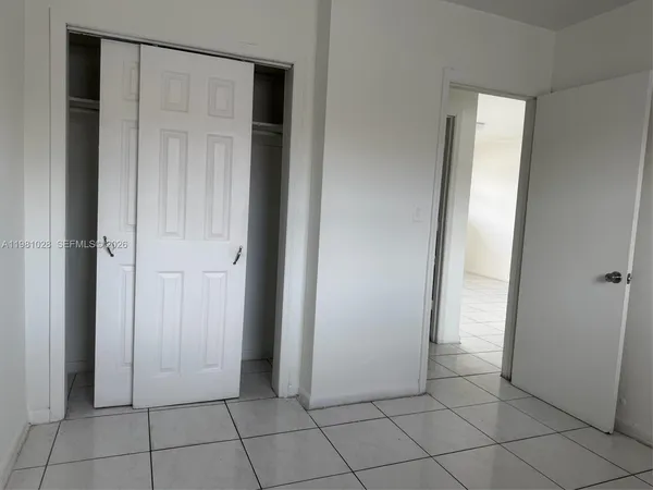 a view of a closet area in a room