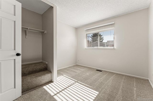 a view of room with window and hallway