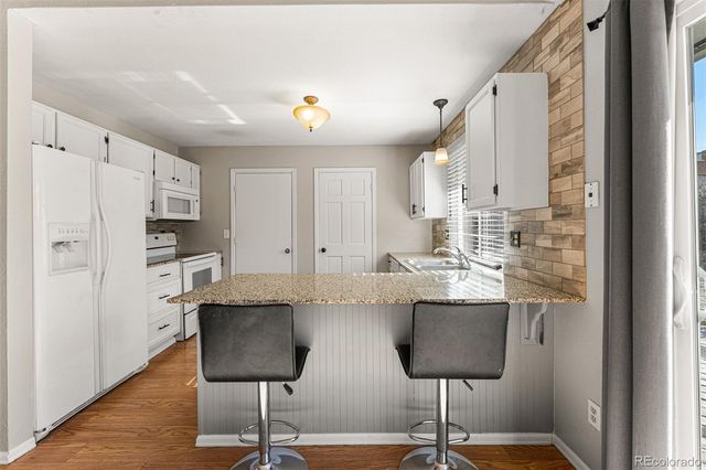 a view of kitchen with cabinets and stainless steel appliances