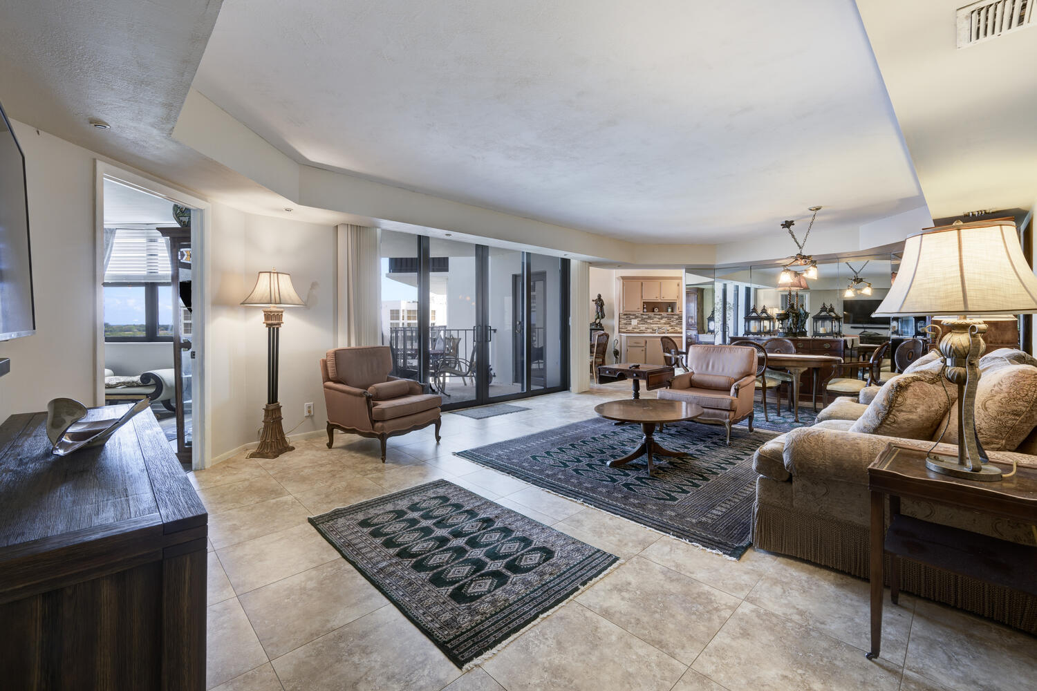 3800 Washington Road, Unit 1002 West Palm Beach, FL 33405 - Photo 12 of 20 a living room with furniture rug and window