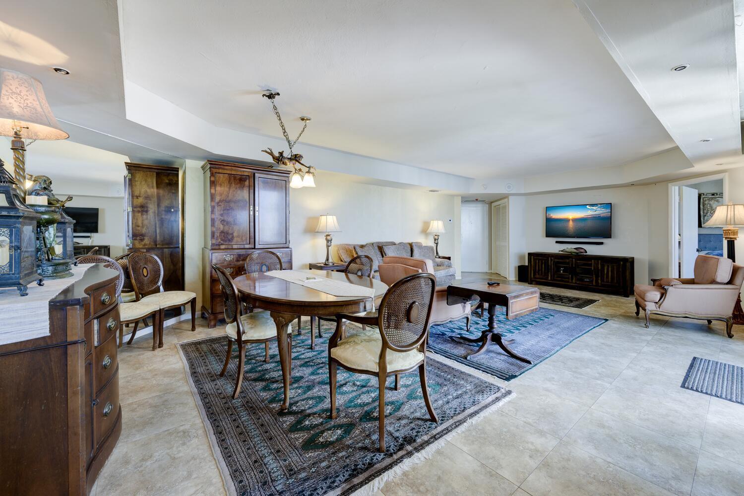 3800 Washington Road, Unit 1002 West Palm Beach, FL 33405 - Photo 15 of 20 a living room with furniture and a fireplace