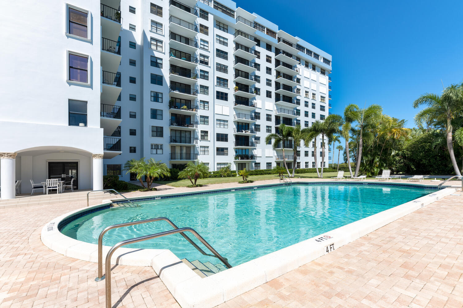 3800 Washington Road, Unit 1002 West Palm Beach, FL 33405 - Photo 4 of 20 a view of swimming pool with outdoor seating