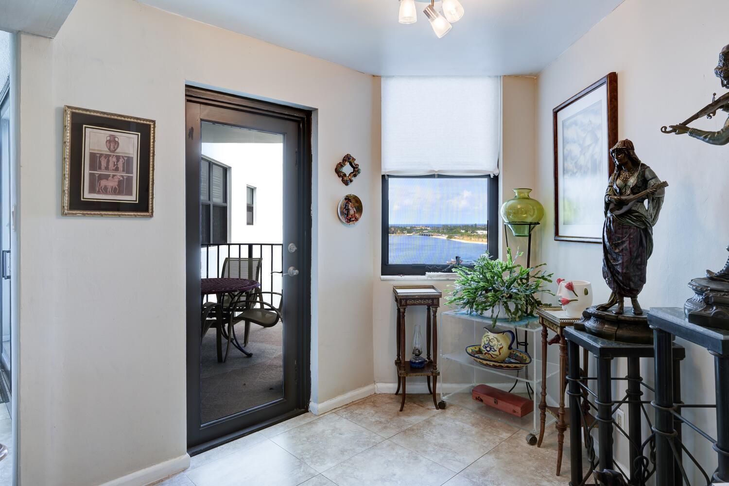 3800 Washington Road, Unit 1002 West Palm Beach, FL 33405 - Photo 6 of 20 a living room with furniture and a potted plant