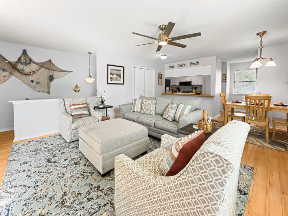 100 North Myrtle Drive, Unit 116 Santa Rosa Beach, FL 32459 - Photo 12 of 29 a living room with furniture and a chandelier