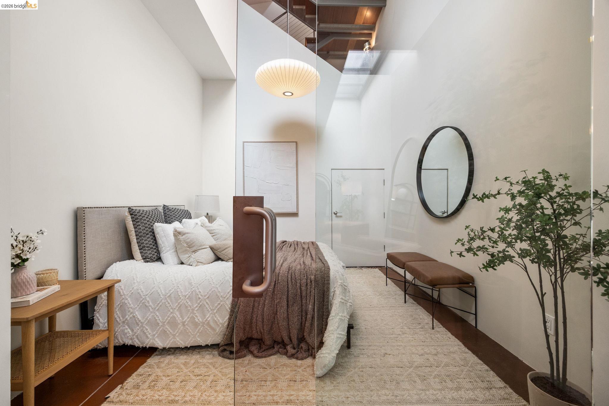 2709 Tenth Street, Unit D Berkeley, CA 94710 - Photo 10 of 29 Hardwood flooring, high ceilings, and a clear glass partition
