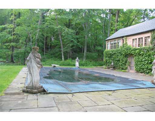 131 Old Mill Road Greenwich, CT 06831 - Photo 10 of 13 a view of a garden with a fountain