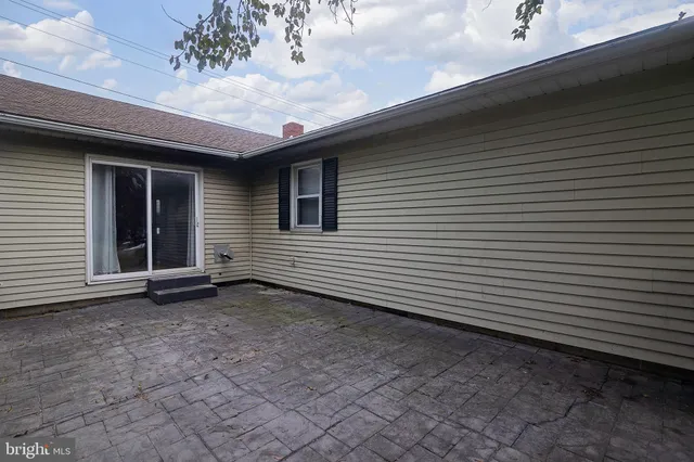 a view of outdoor space with playground and green space