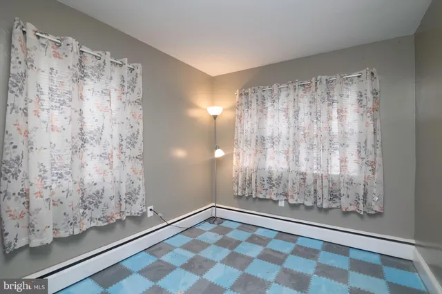 a view of room with window and hardwood floor