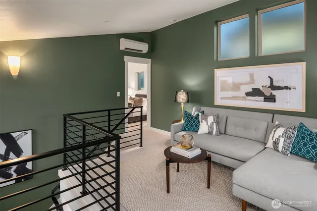 a living room with furniture and a painting