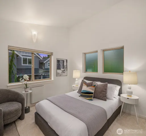 a bedroom with bed and window