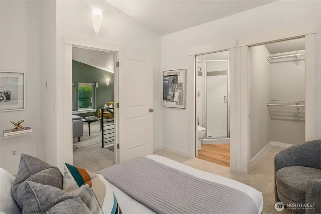 a bedroom with furniture and a wooden floor