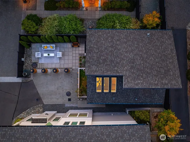 an aerial view of a house with a yard