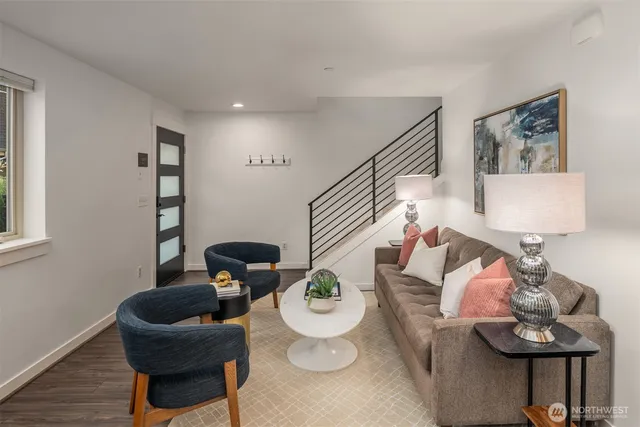 a living room with furniture and flowers