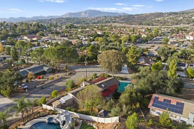 an aerial view of residential house with outdoor space and swimming pool