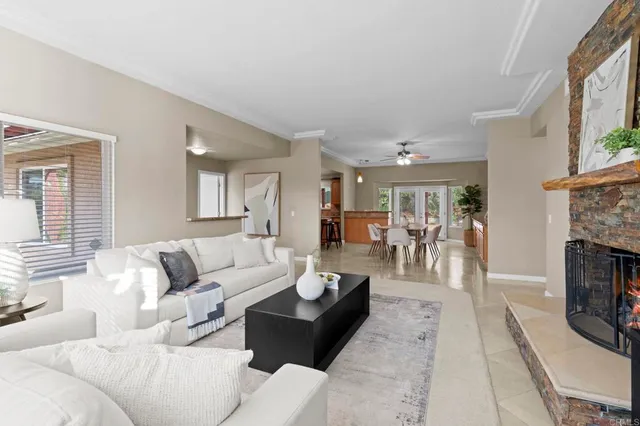 a living room with furniture and a fireplace