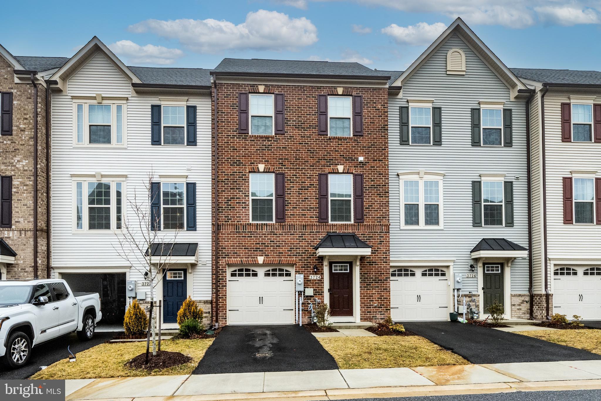3724 Valley Ford Way Hanover, MD 21076 - Photo 1 of 28 a front view of a building with lot of cars parked on road