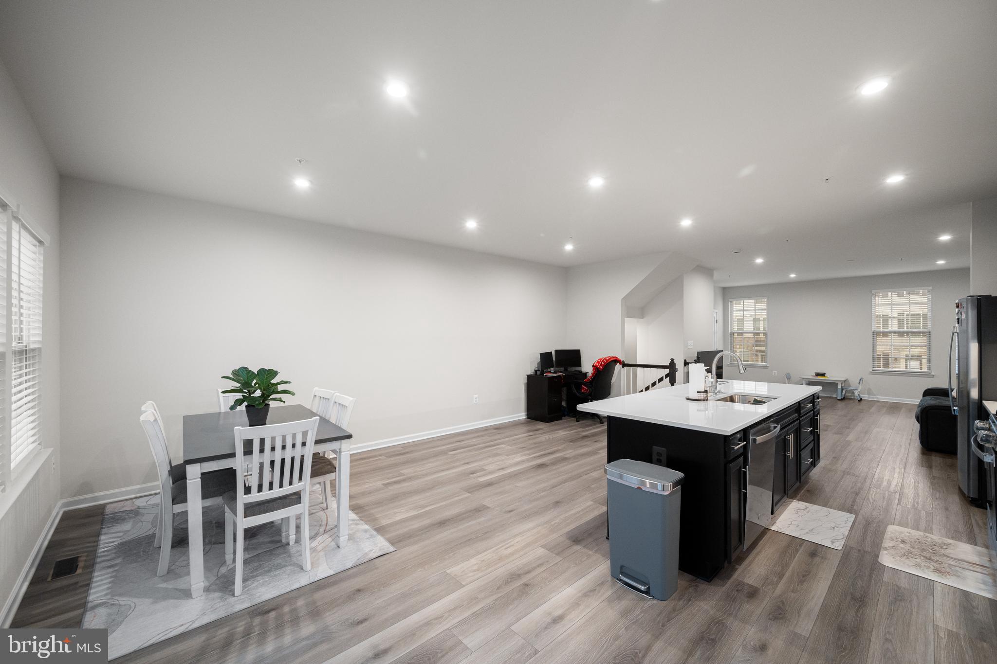 3724 Valley Ford Way Hanover, MD 21076 - Photo 13 of 28 a kitchen with counter space and chairs in it