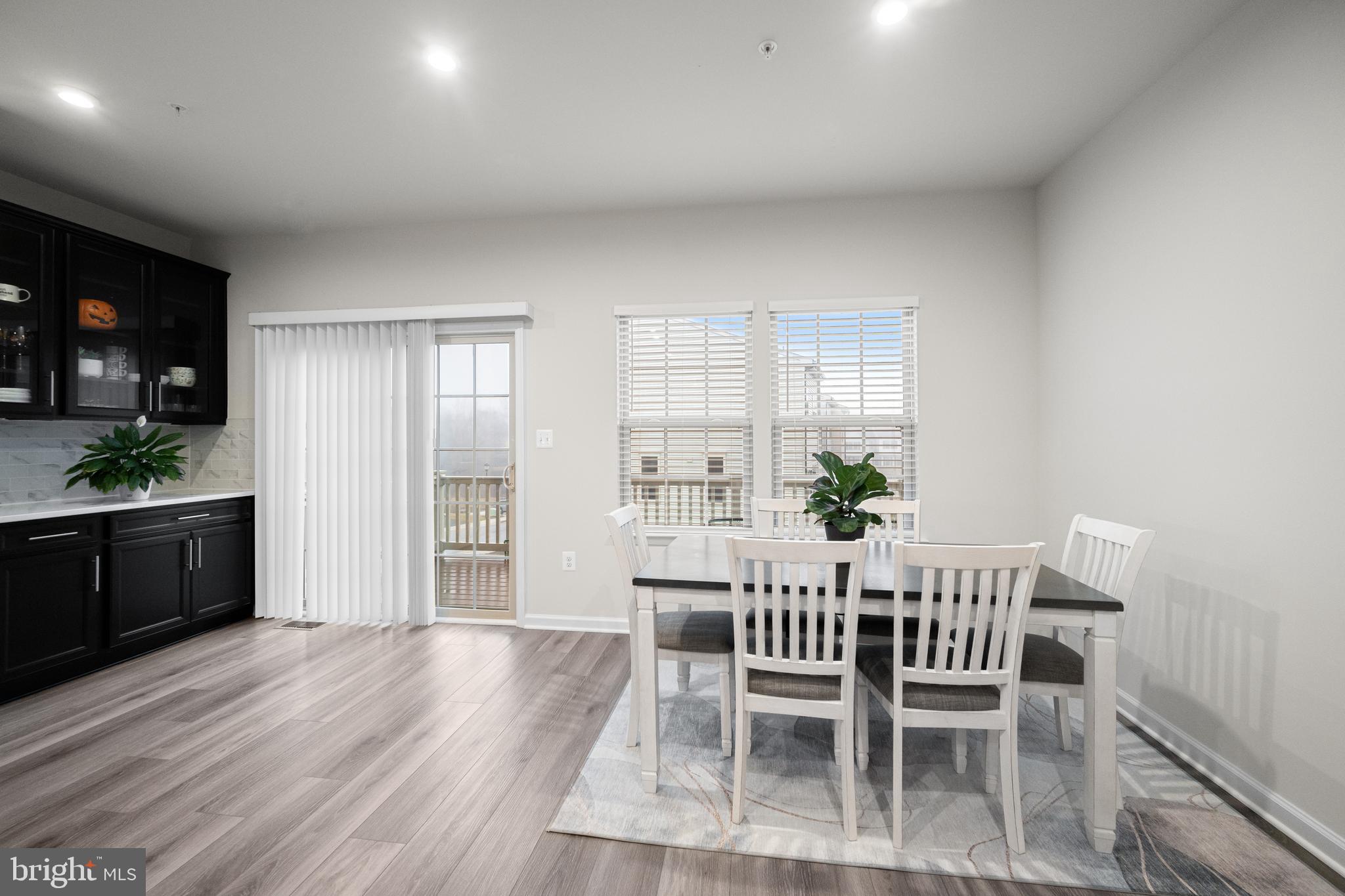 3724 Valley Ford Way Hanover, MD 21076 - Photo 14 of 28 a view of a dining room with furniture and wooden floor