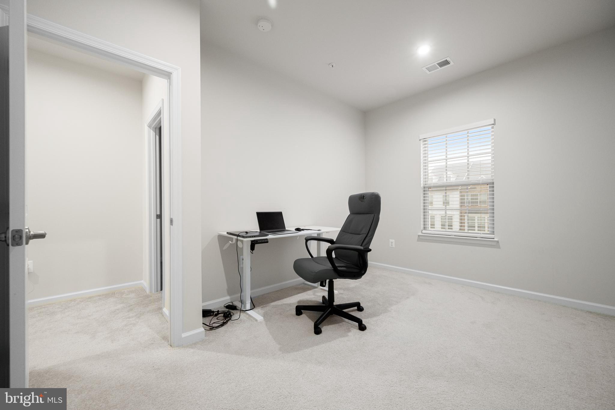 3724 Valley Ford Way Hanover, MD 21076 - Photo 18 of 28 a view of a workspace with furniture and a window