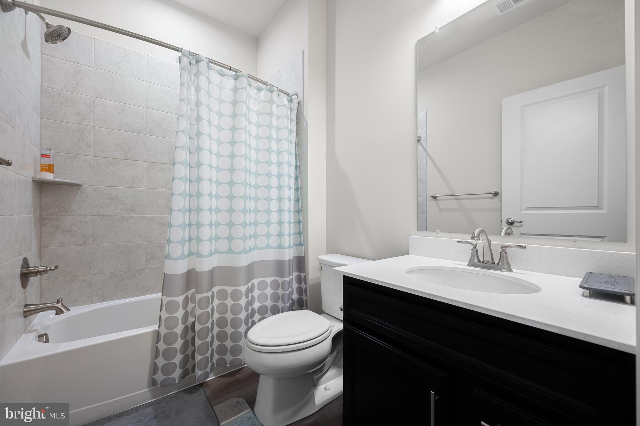 3724 Valley Ford Way Hanover, MD 21076 - Photo 19 of 28 a bathroom with a sink a toilet and shower