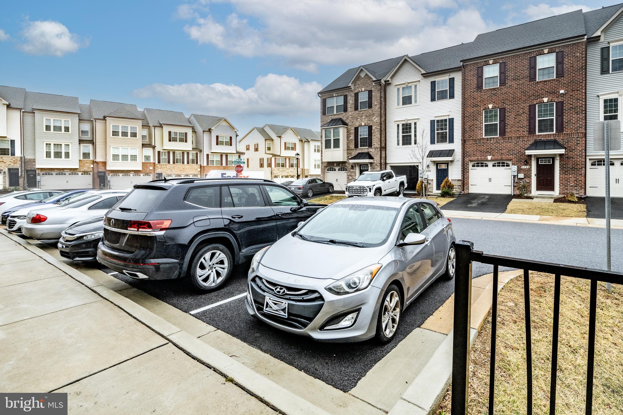 3724 Valley Ford Way Hanover, MD 21076 - Photo 27 of 28 a car parked in front of a brick building