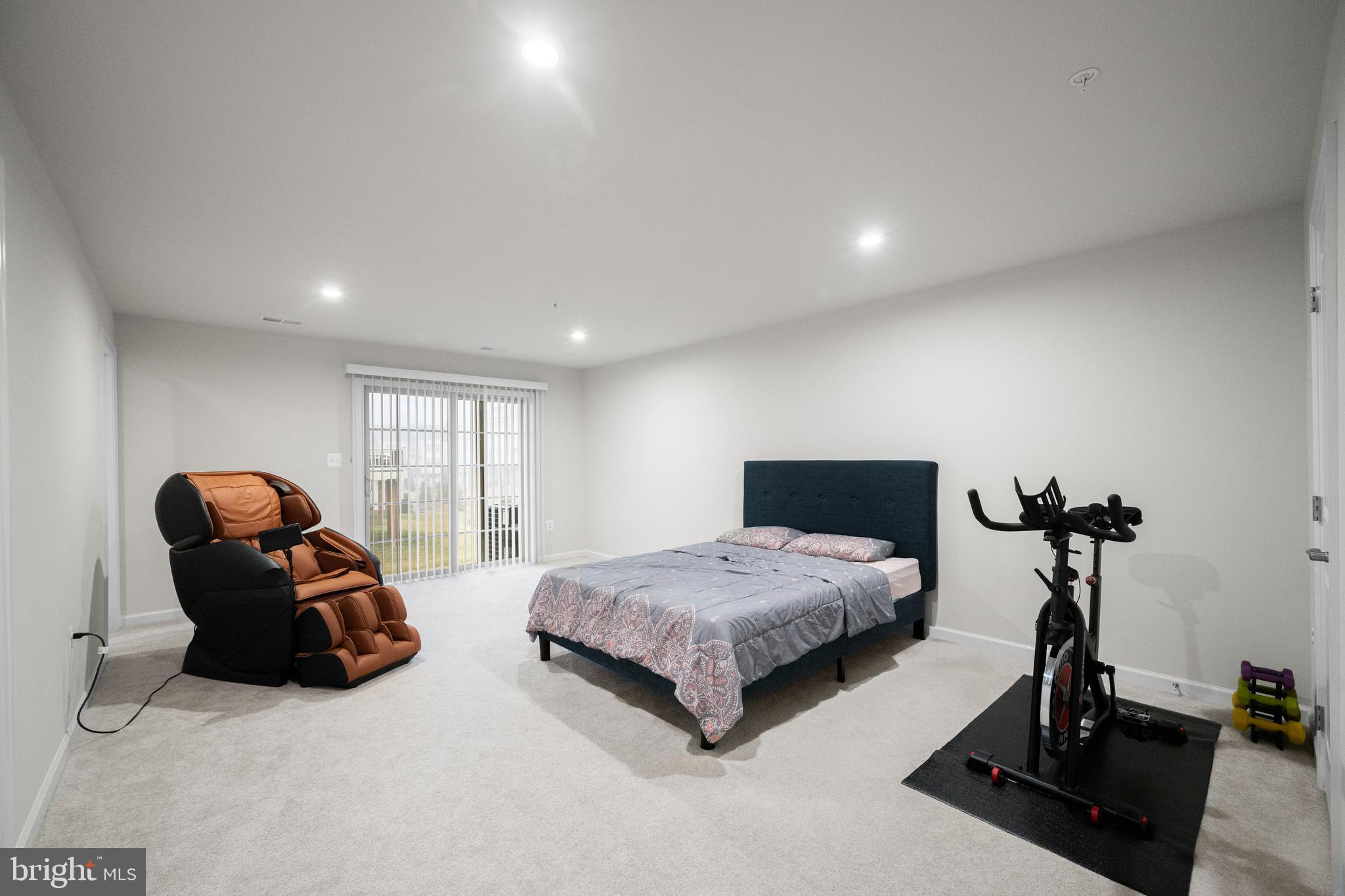 3724 Valley Ford Way Hanover, MD 21076 - Photo 3 of 28 a bedroom with two beds and gym equipment