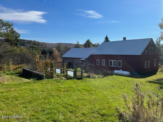 67-78 Brier Road Savoy, MA 01256 - Photo 29 of 36 a view of a house with a yard