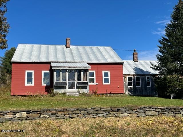 67-78 Brier Road Savoy, MA 01256 - Photo 3 of 36 a front view of a house with a garden
