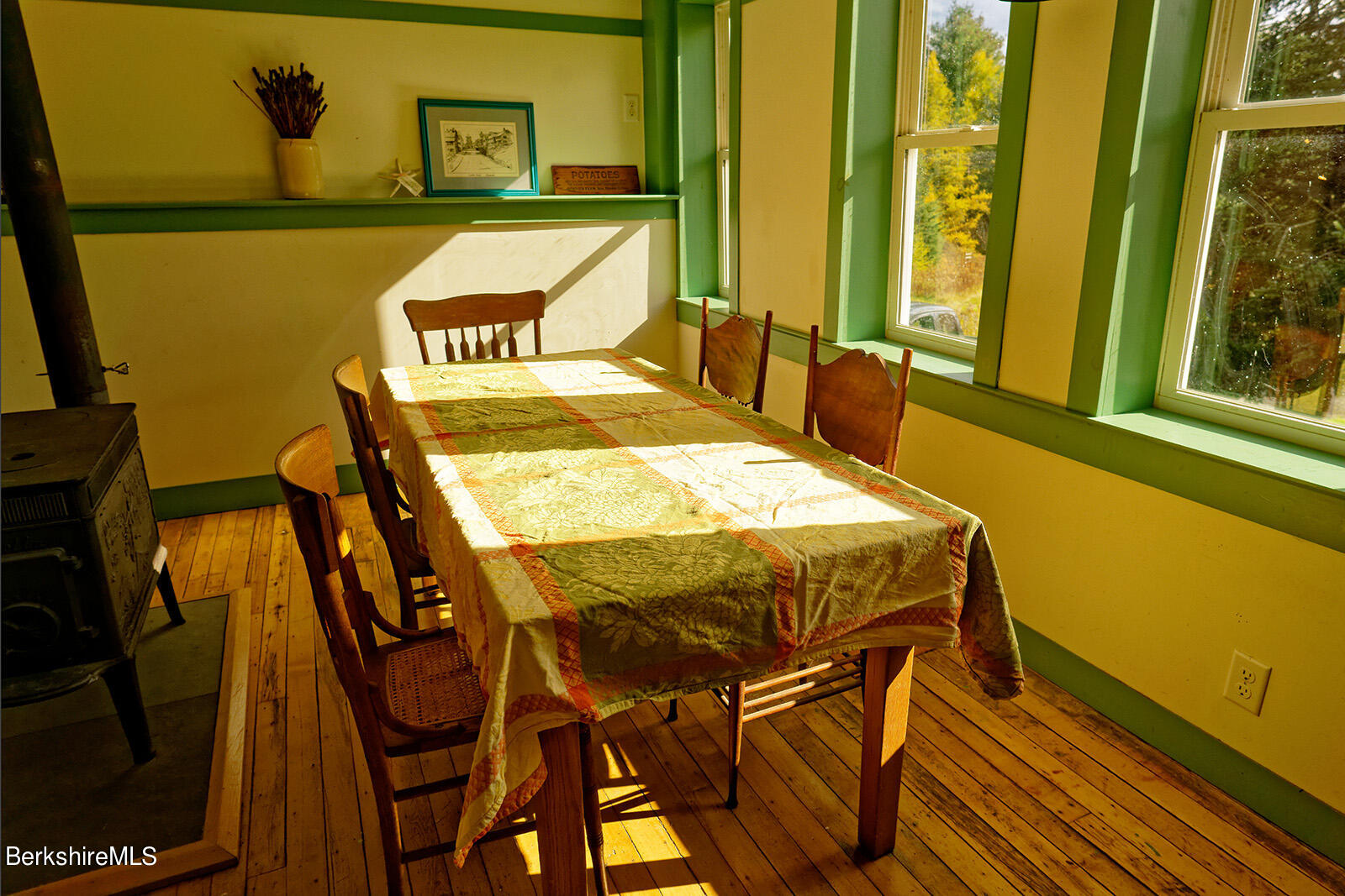 67-78 Brier Road Savoy, MA 01256 - Photo 7 of 36 a dining table sitting next to a window