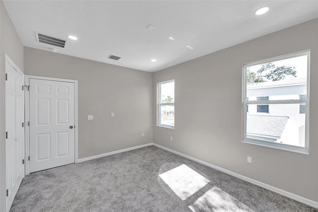 5742 Meadowlane Street New Port Richey, FL 34652 - Photo 20 of 88 a view of an empty room and a window