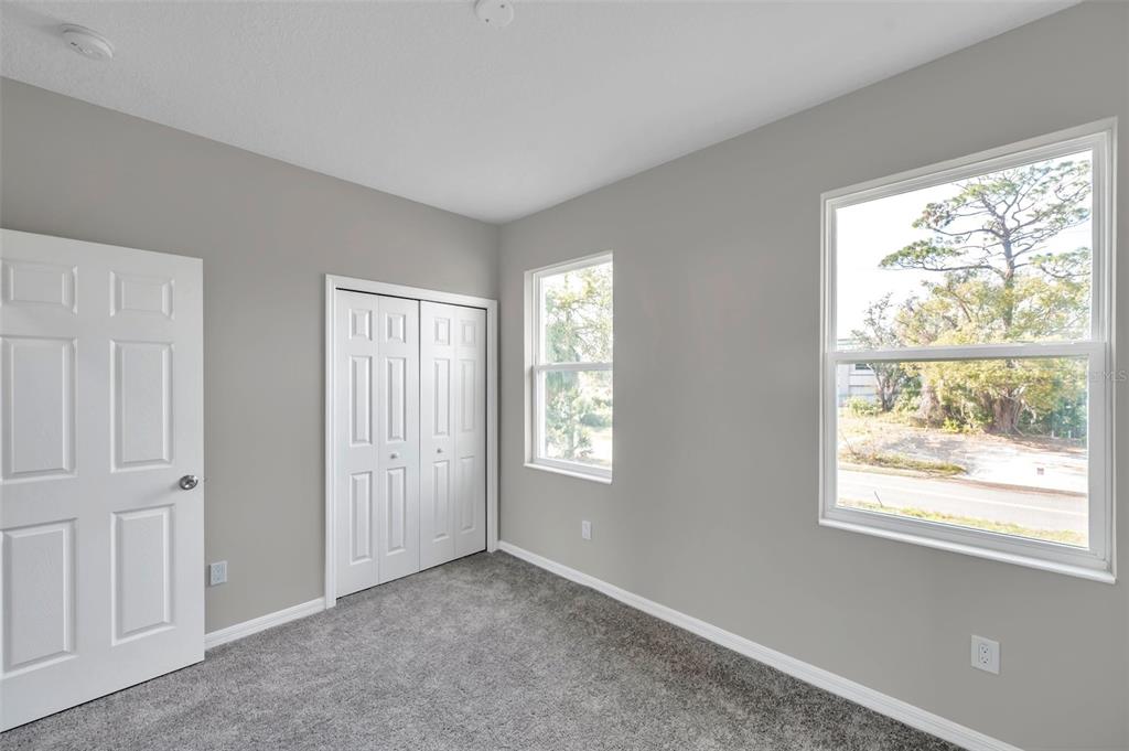 5742 Meadowlane Street New Port Richey, FL 34652 - Photo 27 of 88 a view of an empty room with a window