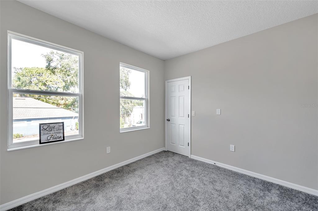 5742 Meadowlane Street New Port Richey, FL 34652 - Photo 33 of 88 a view of an empty room with a window