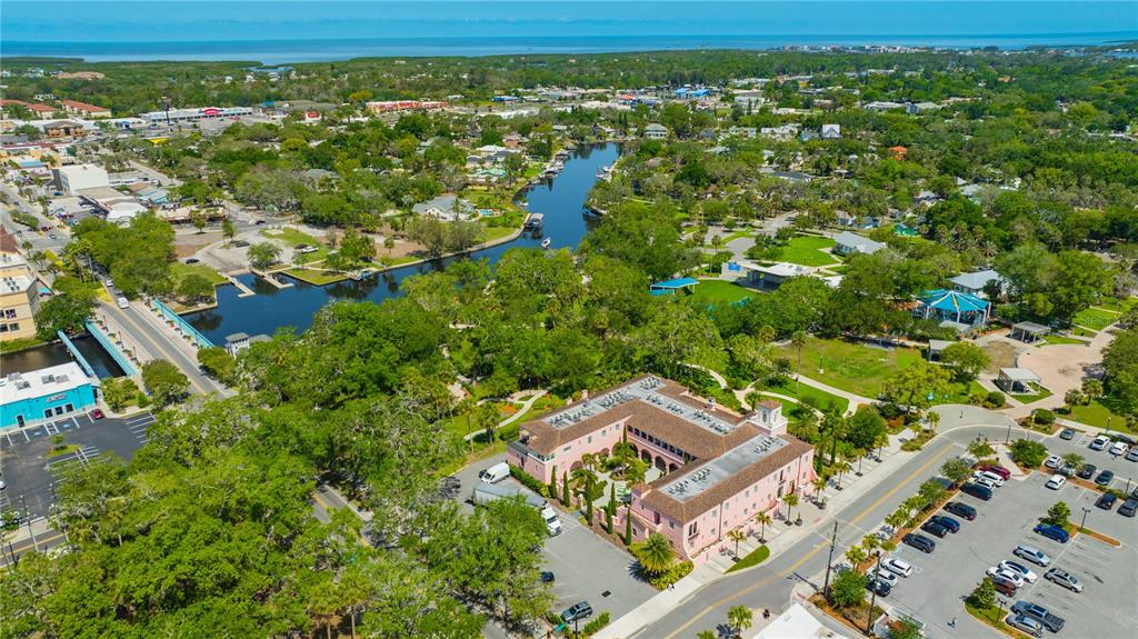 5742 Meadowlane Street New Port Richey, FL 34652 - Photo 57 of 88 an aerial view of residential houses with outdoor space and trees