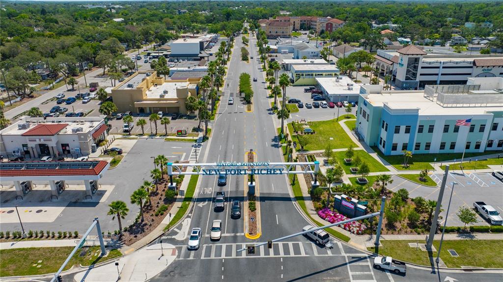 5742 Meadowlane Street New Port Richey, FL 34652 - Photo 66 of 88 an aerial view of residential houses with outdoor space and swimming pool