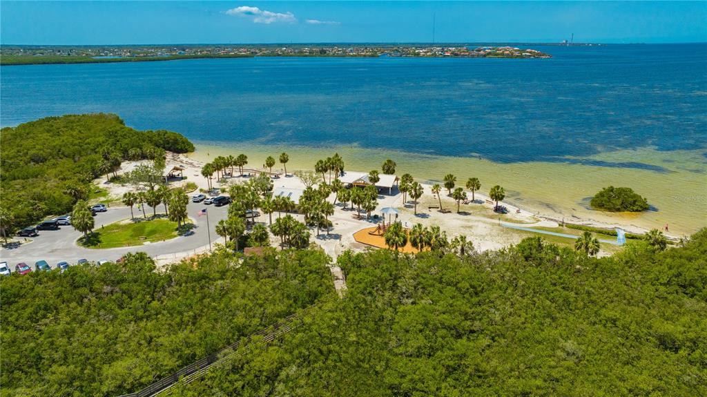 5742 Meadowlane Street New Port Richey, FL 34652 - Photo 73 of 88 a view of a lake with a beach